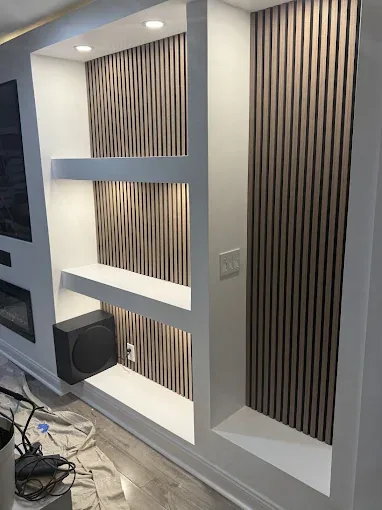 Custom entertainment wall with wood slat details