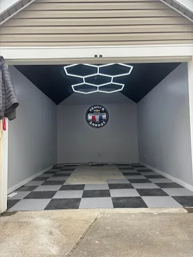 Remodeled garage with checkered flooring and hexagon lights