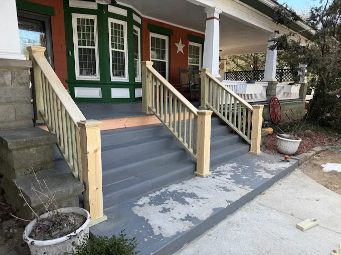 Front porch wooden stairs and newly installed railings