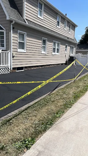 Finished residential asphalt driveway paving project